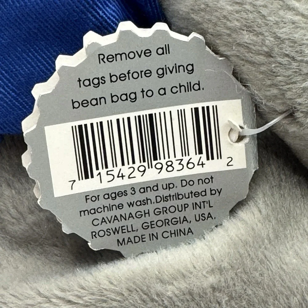Coca-Cola collectible bean‎ bag plush seal from 1998, wearing a delivery outfit